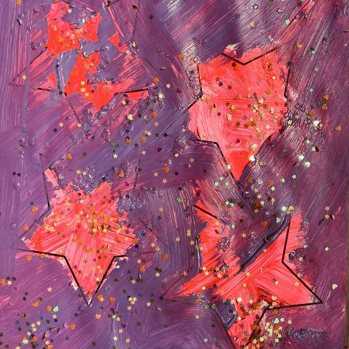 A child's painting of stars in pink and purple, covered in glitter